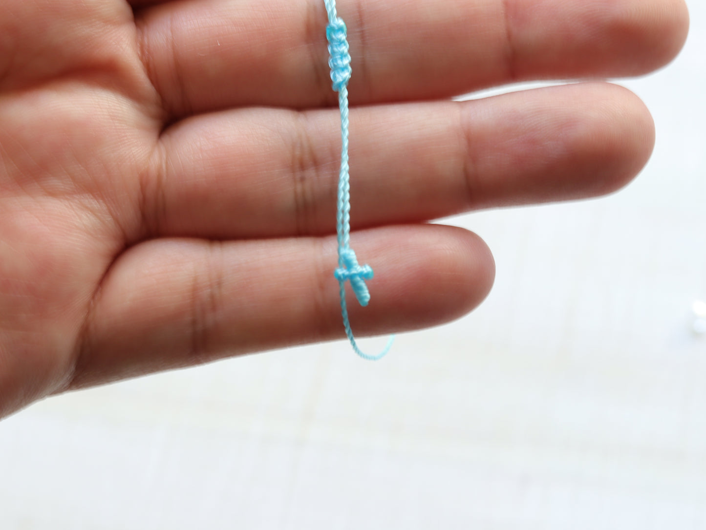 Tiny Cross in Your Choice of Color in Thin Cord Only